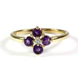 A 9ct yellow gold amethyst and diamond set flower shaped ring, (L.5).