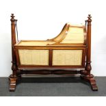 A lovely 19th century walnut and mahogany rocking crib, L. 112cm, H. 96cm.