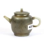 A Chinese pewter overlaid Yixing terracotta teapot with jade spout and handle, H. 11cm.