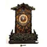 A large mid 19th century Black Forest cuckoo clock by Camerer, Kuss, Tritschler and Co, clock makers