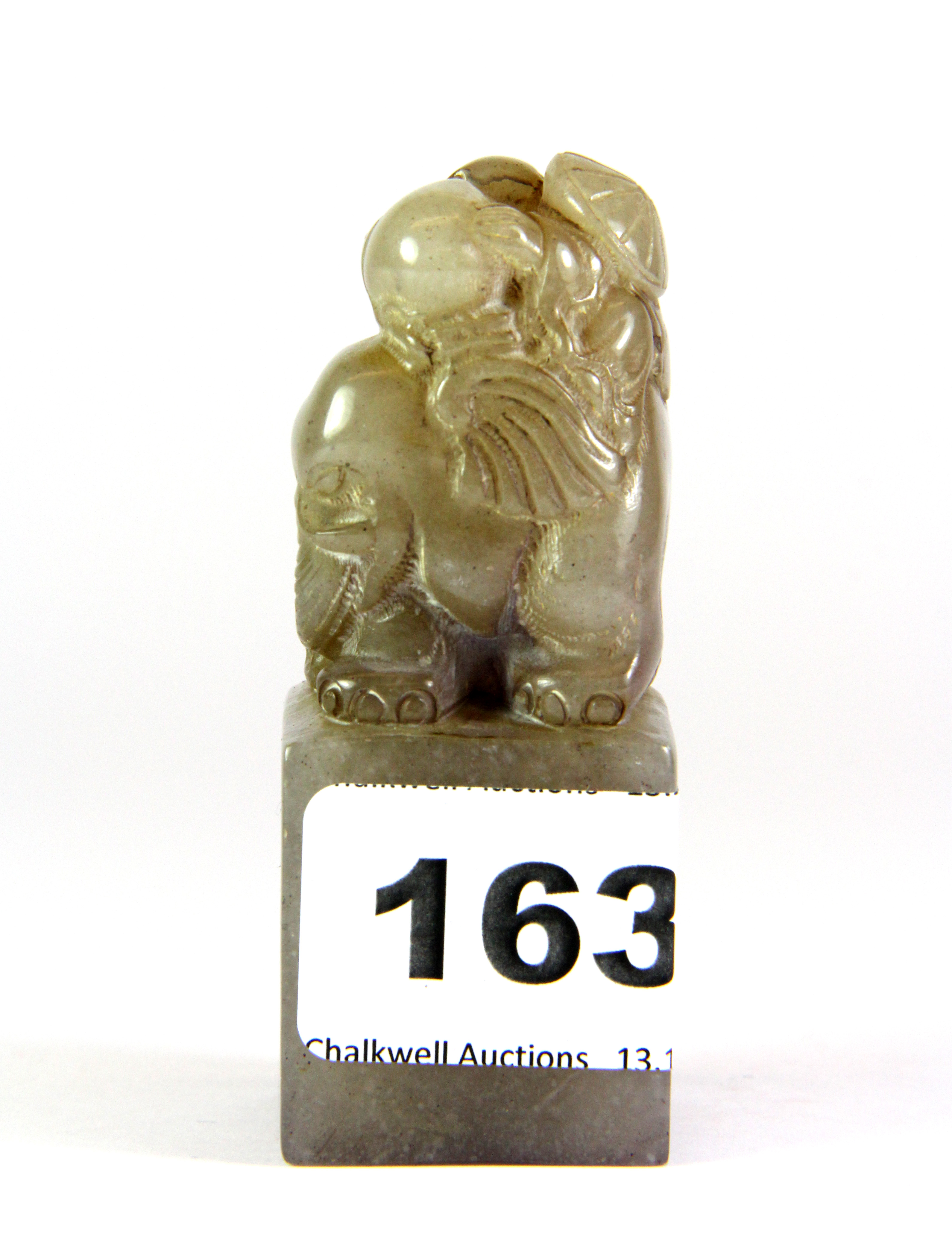 A mid 20th century Chinese carved grey soapstone seal mounted with a boy on an elephant, H. 8cm. - Image 2 of 5