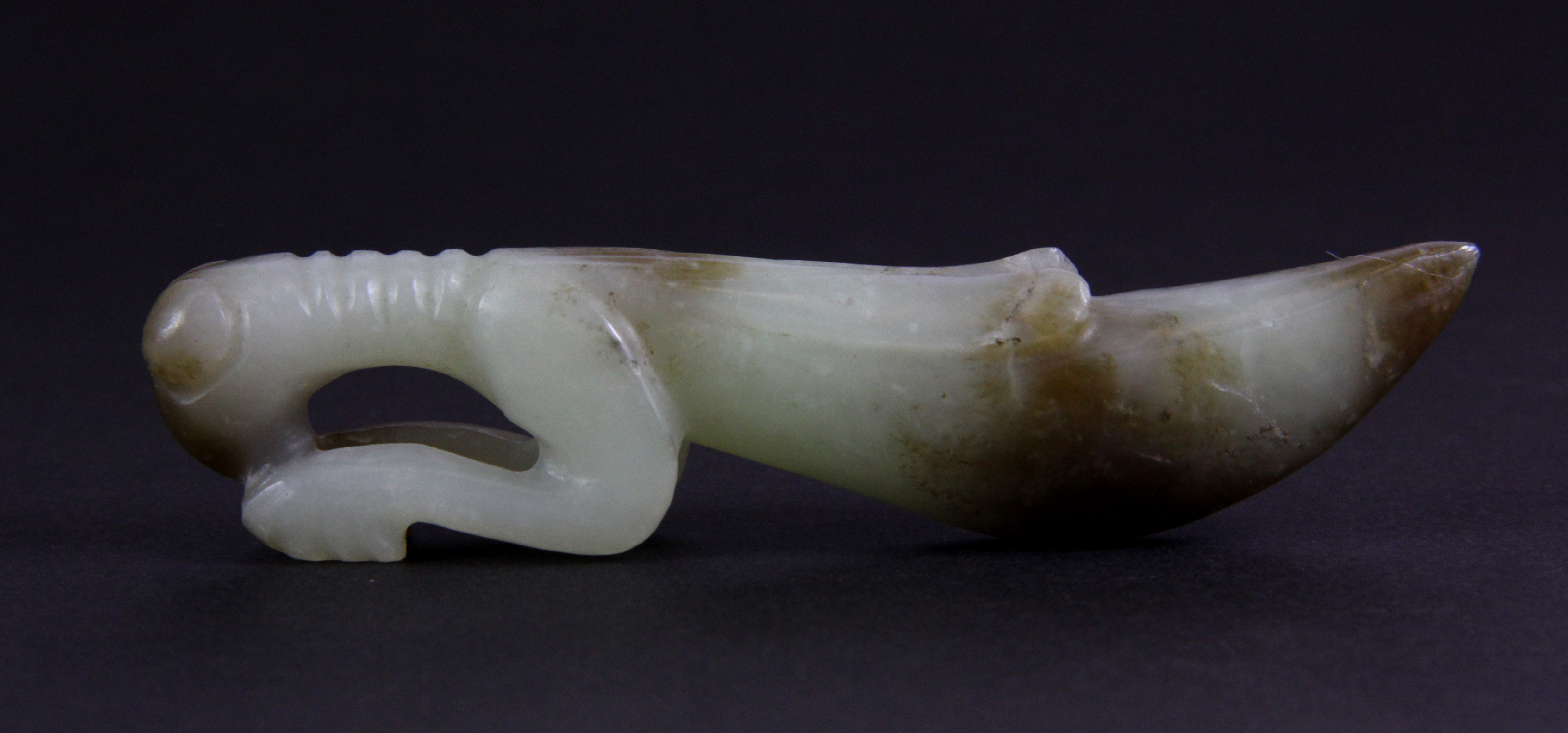 An early 20th century Chinese carved nephrite jade figure of a praying mantis, L. 9.5cm.