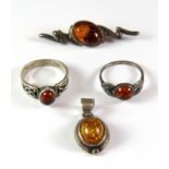 A quantity of silver mounted amber jewellery.