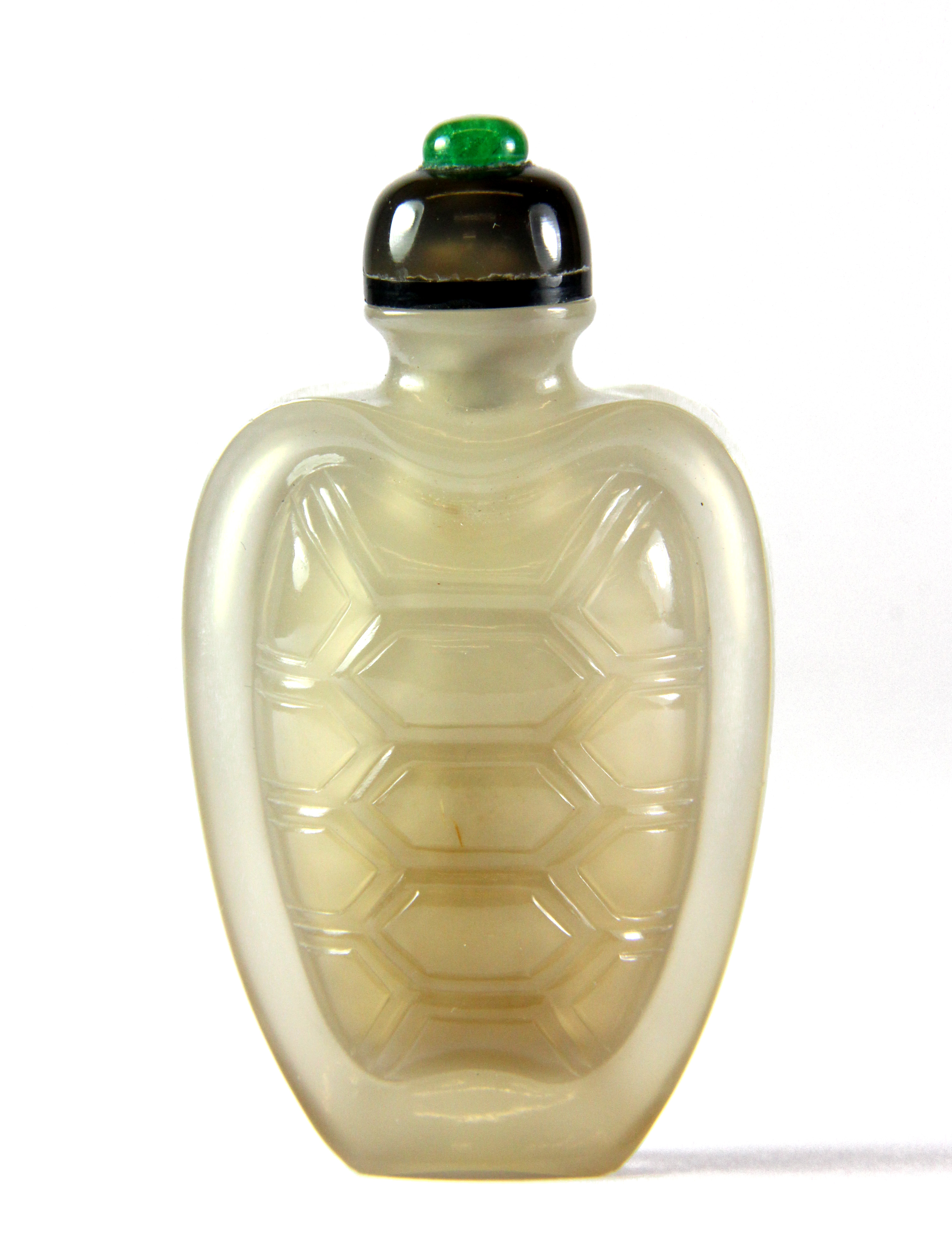 A Chinese carved chalcedony turtle shell shaped snuff bottle with chalcedony and jade stopper, L.