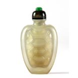 A Chinese carved chalcedony turtle shell shaped snuff bottle with chalcedony and jade stopper, L.