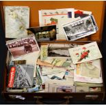 A vintage case of old postcards and greetings cards.