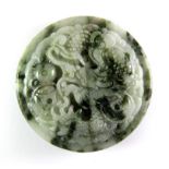 A Chinese mixed colour jade dragon buckle, Dia. 5.5cm.