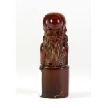 A carved Chinese horn seal, H. 6.5cm.