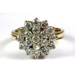 A 9ct yellow gold stone set cluster ring, (K).