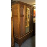 An interesting copper inlaid Art Nouveau oak wardrobe, W. 124cm, H. 197cm.