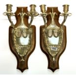 A pair of wall mounted silver plated Adam style candle holders, H. 44cm.