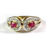 A 9ct yellow gold ruby and diamond set ring (L.5).