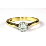 A 9ct yellow gold (stamped 9ct) solitaire ring set with a brilliant cut synthetic mossanite, (N.5).