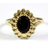 A 9ct yellow gold onyx set ring, (P.5).