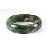 A very fine carved moss agate bangle, Dia. 7.5cm.