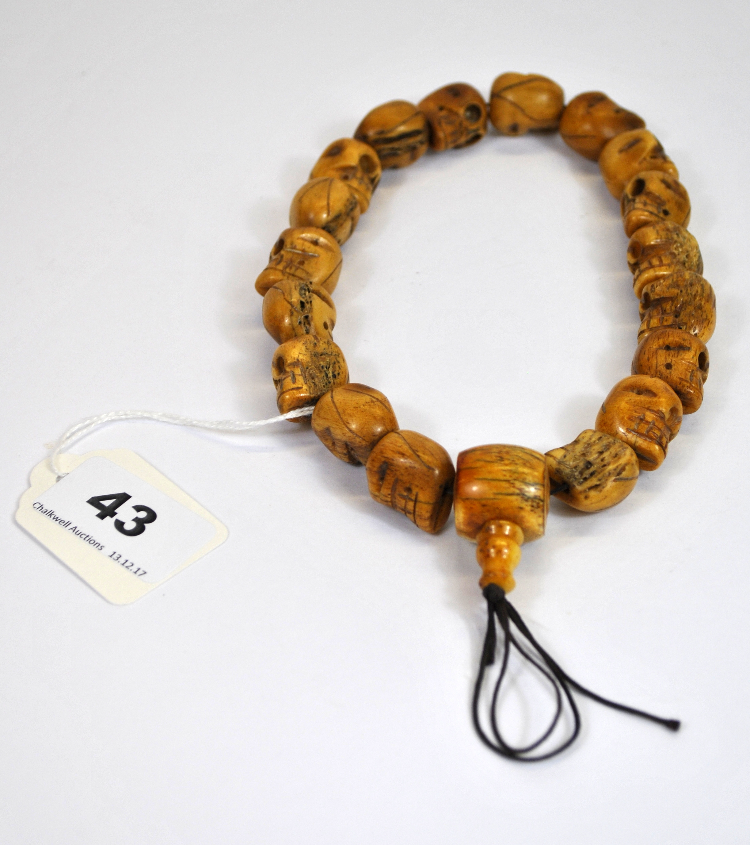 An interesting strand of Tibetan carved bone skull prayer beads, 1.5 x 2cm.