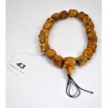 An interesting strand of Tibetan carved bone skull prayer beads, 1.5 x 2cm.