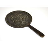 An old Chinese cast bronze hand mirror, L. 18cm.