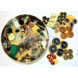 A tin of vintage buttons.