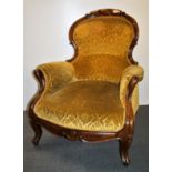 A 19th century upholstered mahogany gentleman's armchair.