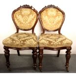 A pair of 19th century upholstered mahogany hall chairs.