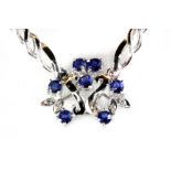 A 14ct white gold (stamped 585) sapphire and diamond set necklace.