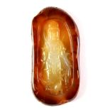 A very attractive Chinese carved banded agate amulet of the Goddess Guanyin, L. 9.5cm.