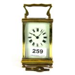 A gilt brass carriage clock with key, H. 15cm.