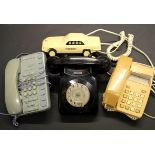 Four vintage telephones.