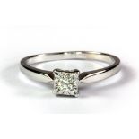 A 9ct white gold diamond set solitaire ring, (Q.5).