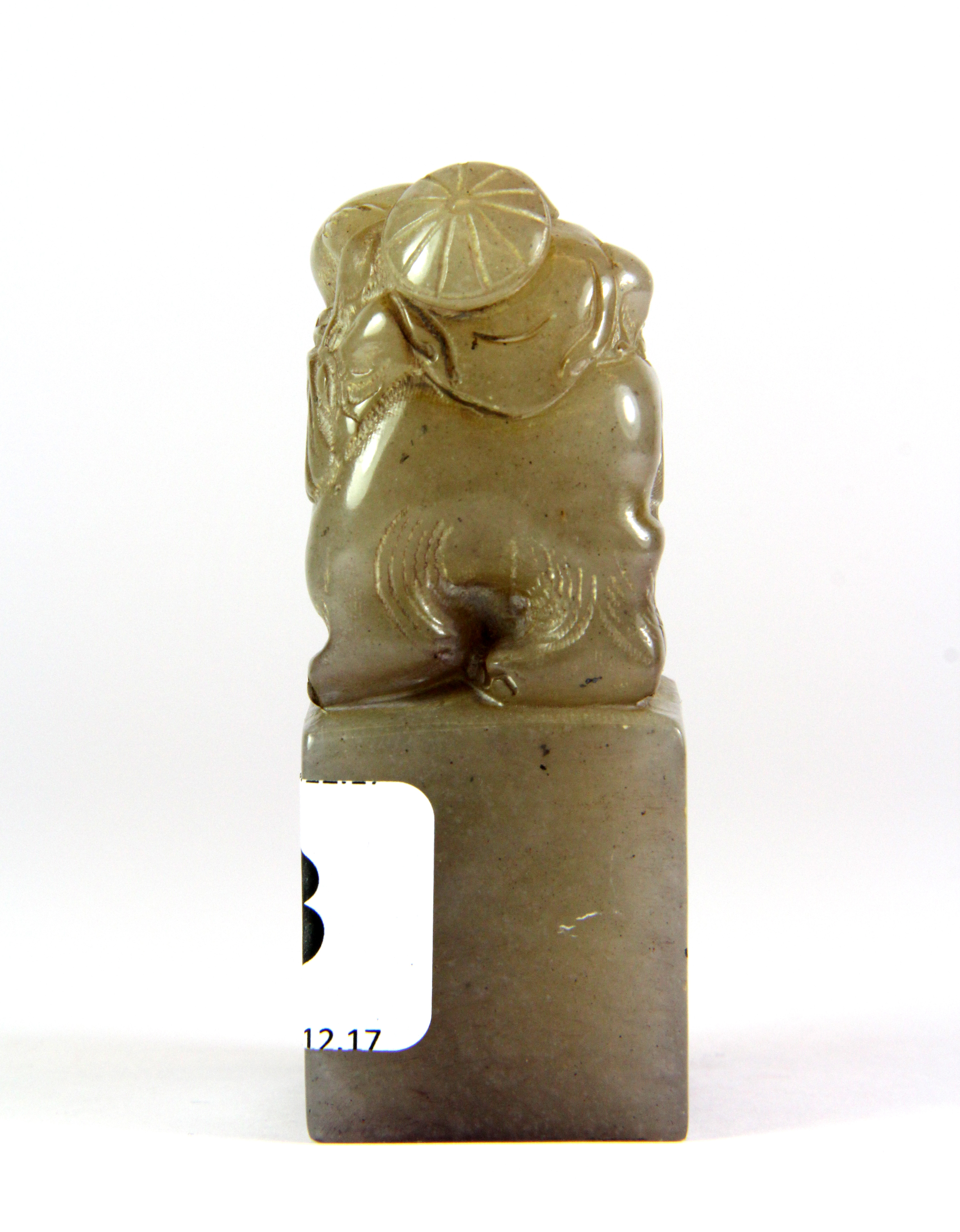 A mid 20th century Chinese carved grey soapstone seal mounted with a boy on an elephant, H. 8cm. - Image 3 of 5