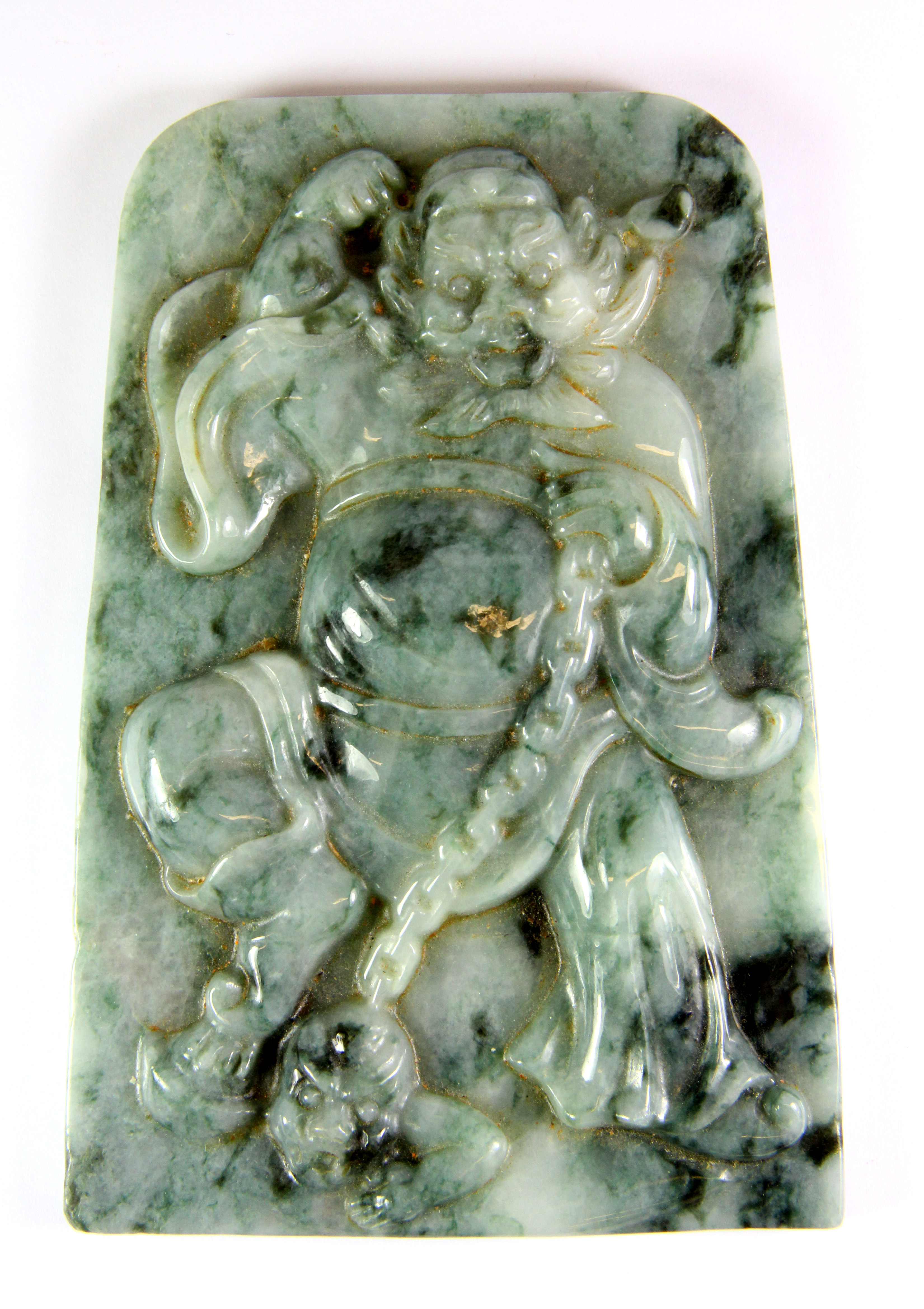 A fine Chinese 19th century / early 20th century mixed colour jadeite jade panel of a guardian