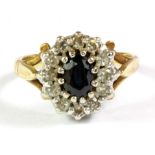 A 9ct yellow gold sapphire and diamond cluster ring, (N).