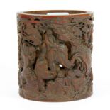 A very detailed carved Chinese bamboo brush pot featuring the eighteen Lohan, H. 13cm, Dia. 12cm.