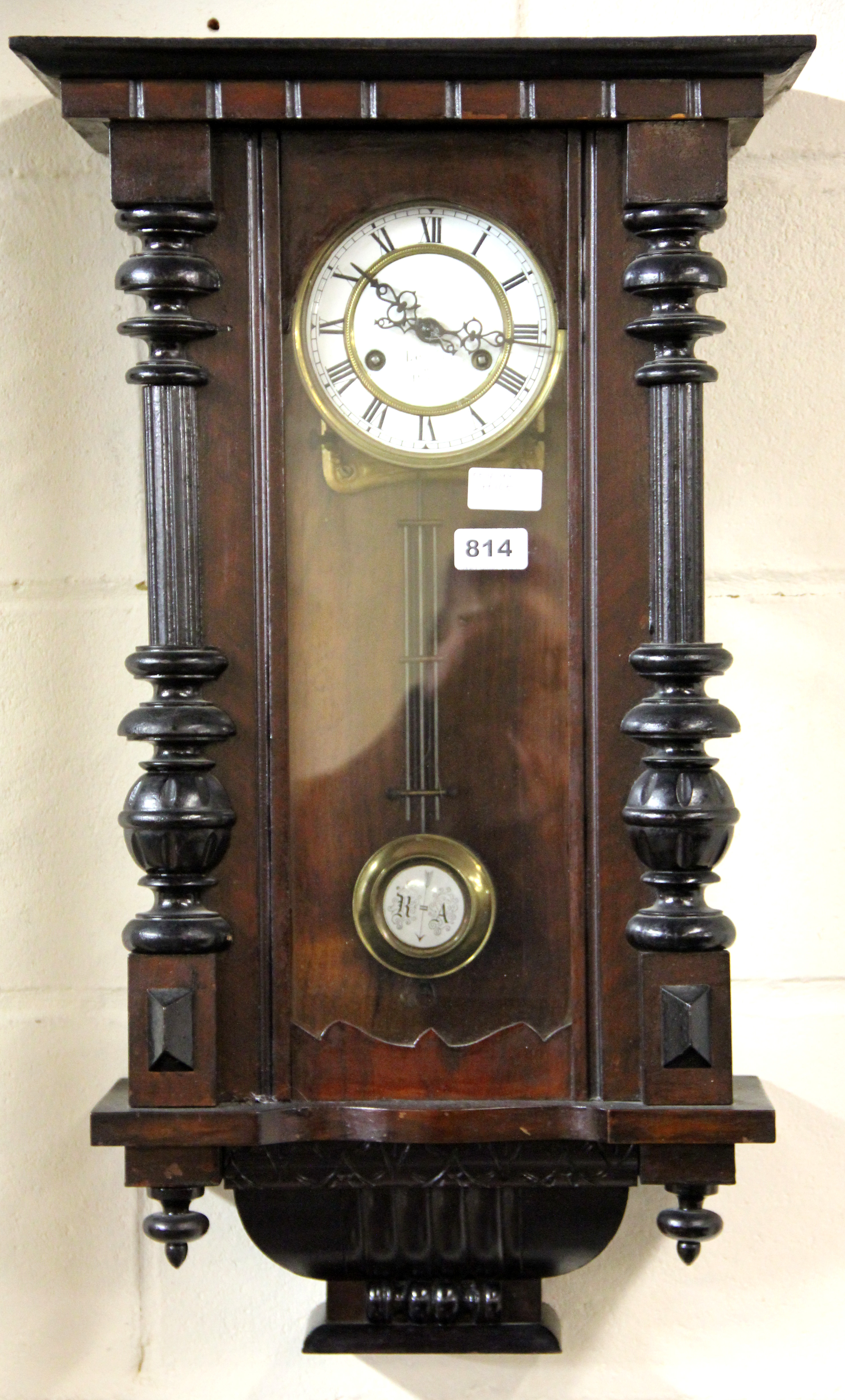 An early 20th century French wall clock, H. 70cm.