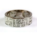 A 9ct white gold diamond set Greek key pattern ring, (S.5).