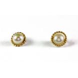 A pair of 9ct yellow gold pearl earrings.