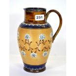 A hallmarked silver mounted Doulton Lambeth stoneware jug, H. 24cm, (restored handle).