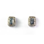 A pair of 9ct white gold aquamarine and diamond set stud earrings.