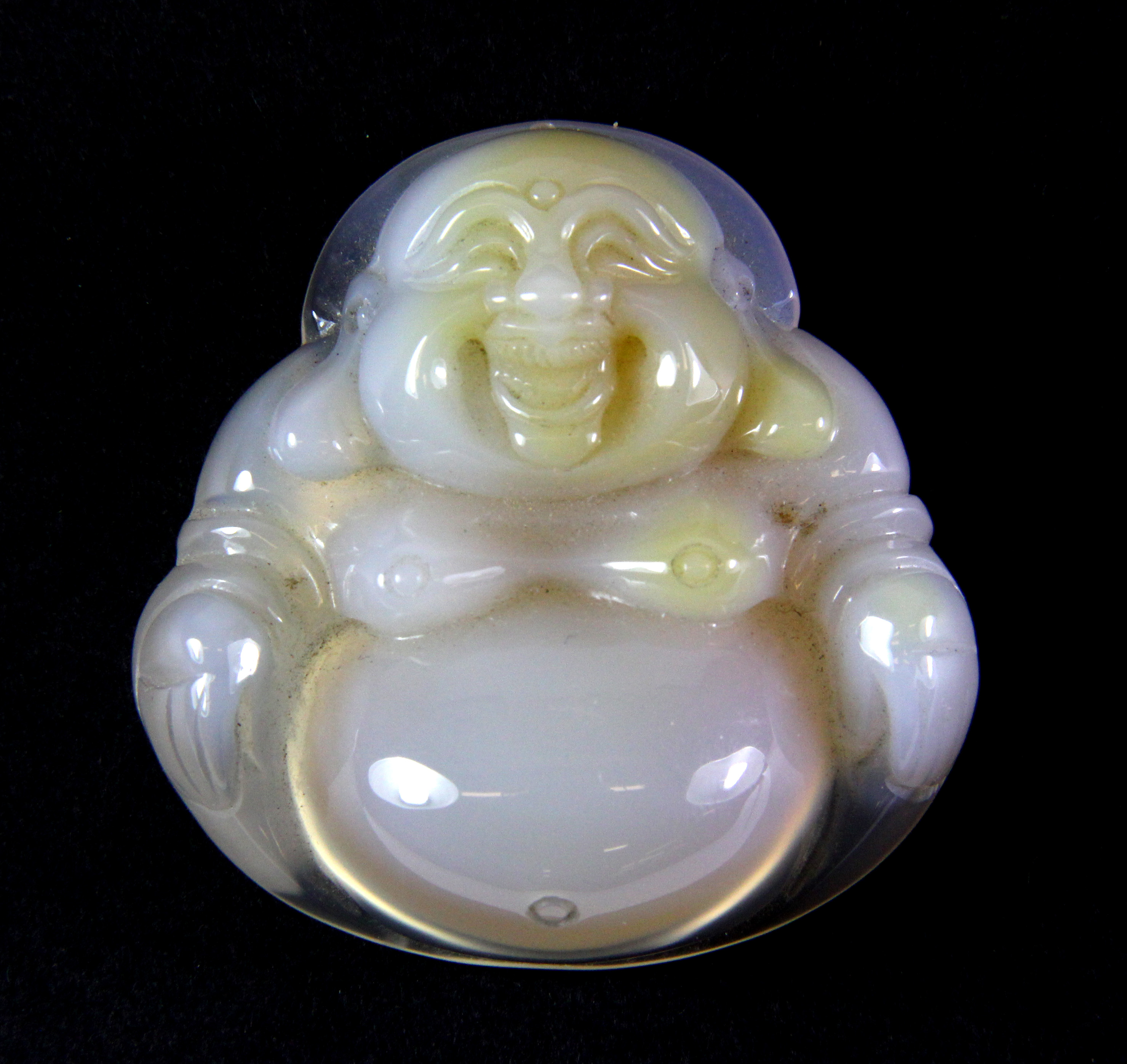 A deeply carved Chinese chalcedony amulet of the Happy Buddha, H. 4.5cm.