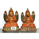 Two 19th century Tibetan painted and sun baked clay temple figures of the Sixth Dalai Lama, each