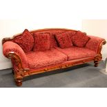 A 19th century oak framed scroll end couch with ornately carved back and detail, W. 227cm.