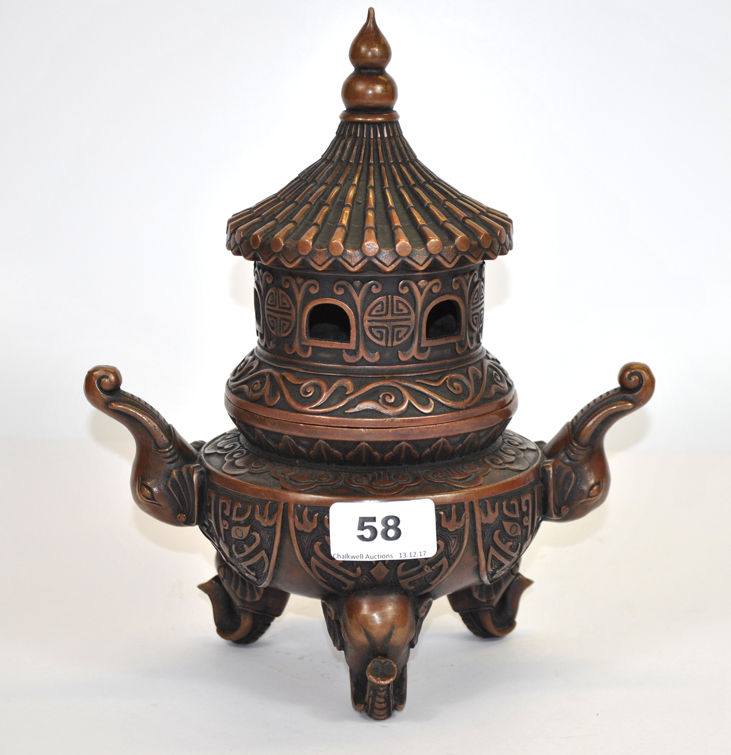 A good quality Chinese cast bronze pagoda censer with elephant head handles and feet, H. 26cm.