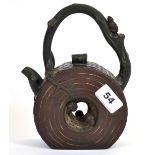 A Chinese hand made two colour Yixing terracotta tea pot, H. 20cm.