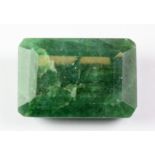 An unmounted emerald cut 106.5ct emerald.