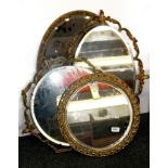 Four gilt framed mirrors.