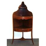 A Georgian mahogany corner washstand, H. 125cm.