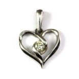 A Sirena 10ct white gold diamond set heart shaped pendant, L. 2cm.