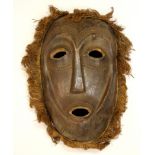 A large carved wooden African tribal mask, 49 x 30cm.