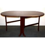 A 1970's mahogany drop leaf dining table, W. 92cm, opens to 155cm.